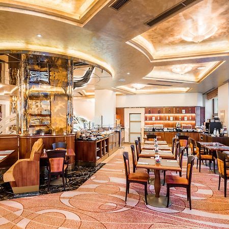 Hotel Occidental Praha Wilson Esterno foto The restaurant
