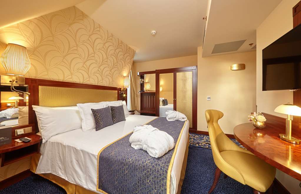 Hotel Occidental Praha Wilson Camera foto A room at the hotel